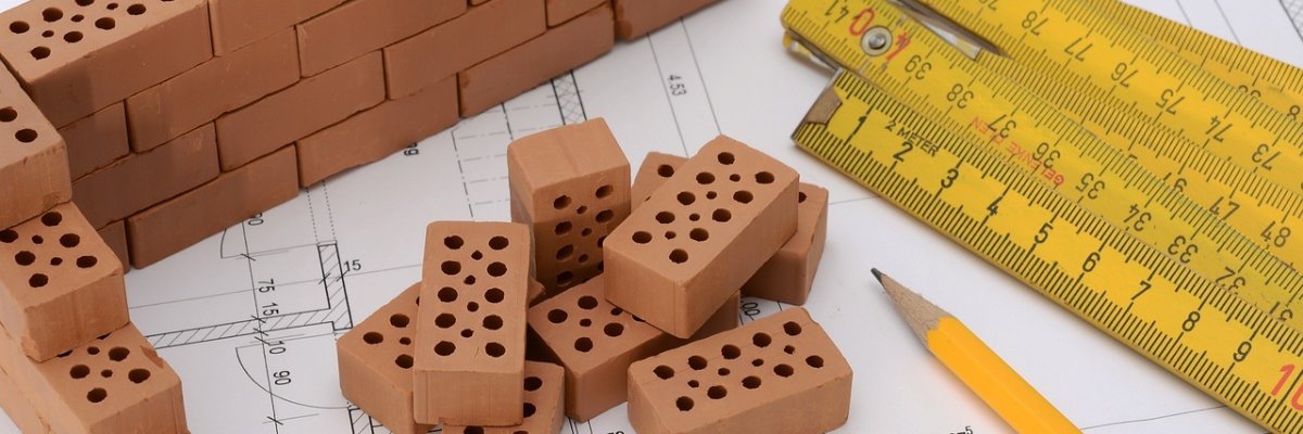 Allgemein grafische Darstellung für Bauen mit Zollstock, Bausteine, Bleistift und Zeichnung